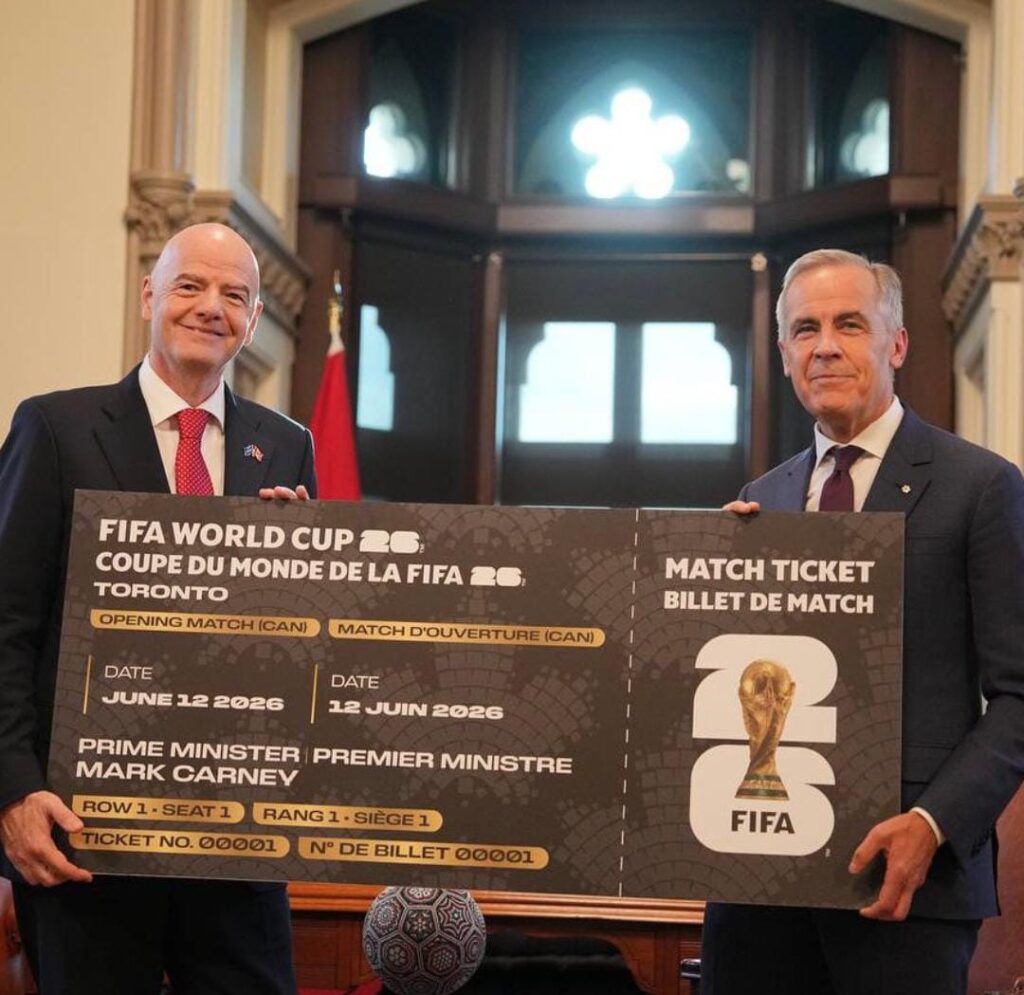 Canada Prime Minister Mark Carney (right) is presented with a novelty World Cup ticket by FIFA president Gianni Infantino on Oct. 11.