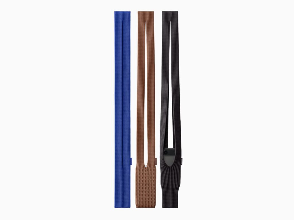 The long strap design is available in three colors: sapphire, cinnamon, and black.